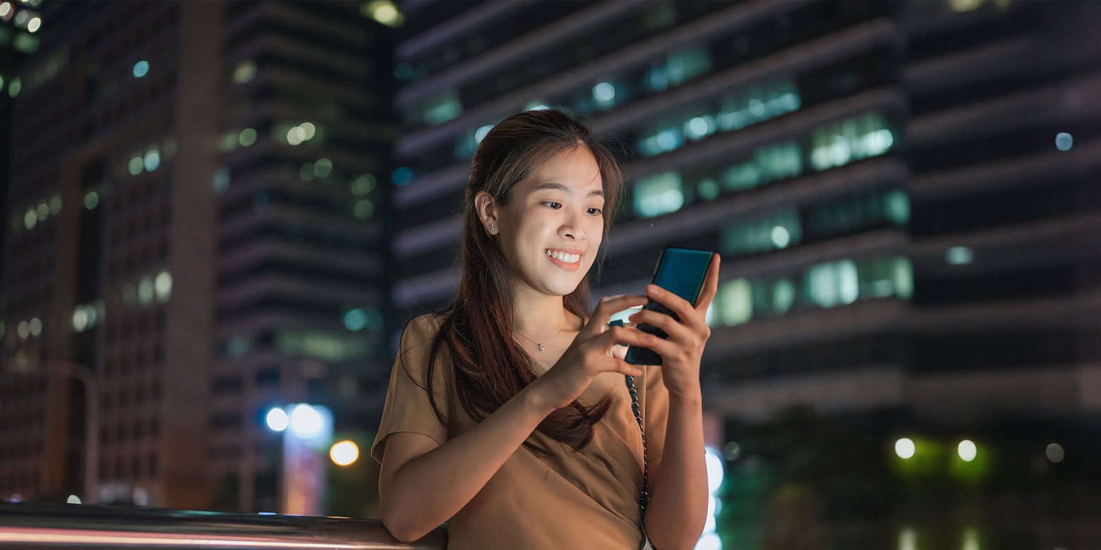 Younger woman looking at phone
