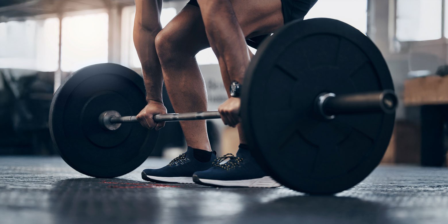 Lifting a barbell with heavy weights