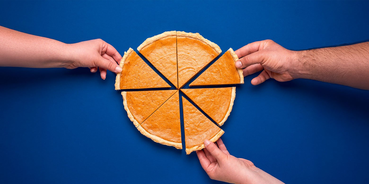 Three hands reaching for a slice of pie