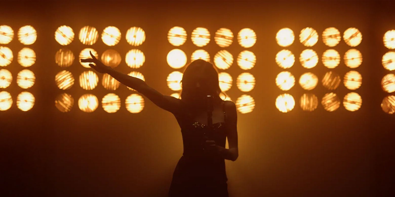 Singer performing under the bright lights