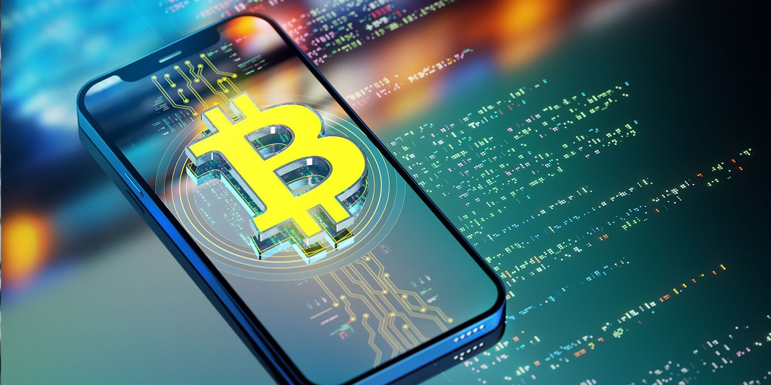 Bitcoin logo on a cell phone with a high tech background