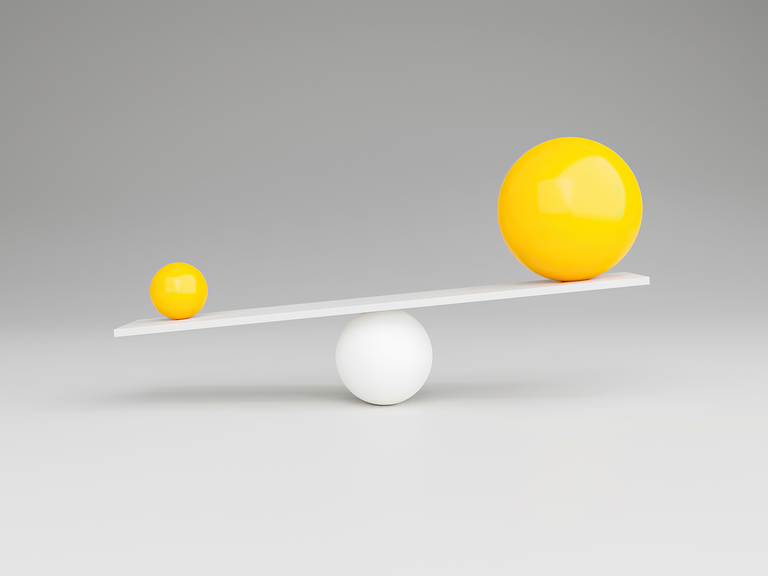 Two yellow balls sit on a white see saw; the smaller ball appears heavier.