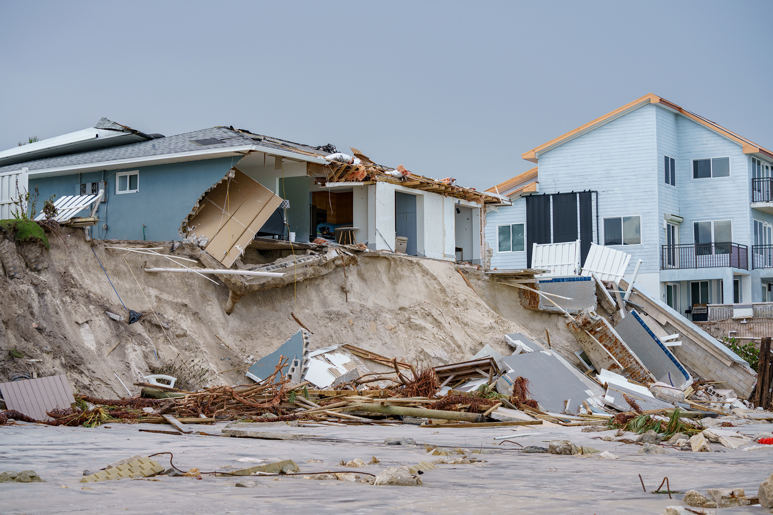 A beach house has collapsed after a storm.